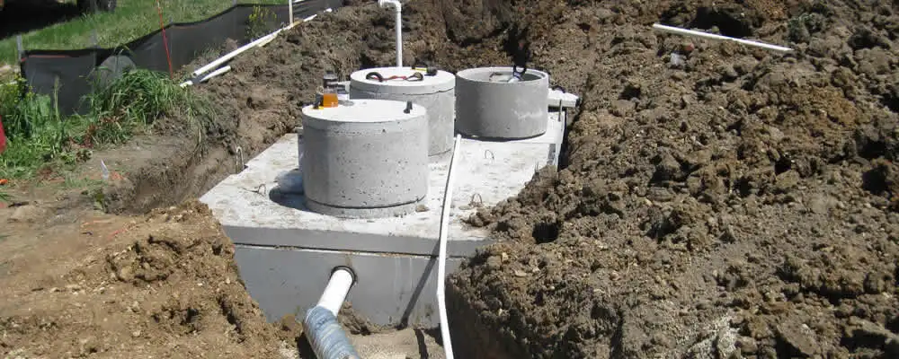 Septic system repair and installation site with tank access ports in Champaign, IL