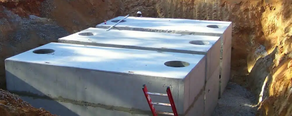 Septic tank installation site with a newly placed concrete tank in Champaign, IL